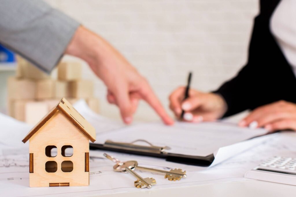 House keys resting on a mortgage document, representing homeownership dreams secured by term life insurance millennials.