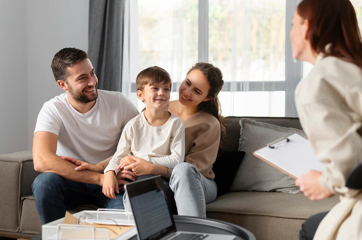 Smiling family sitting together, representing peace of mind from having life insurance"