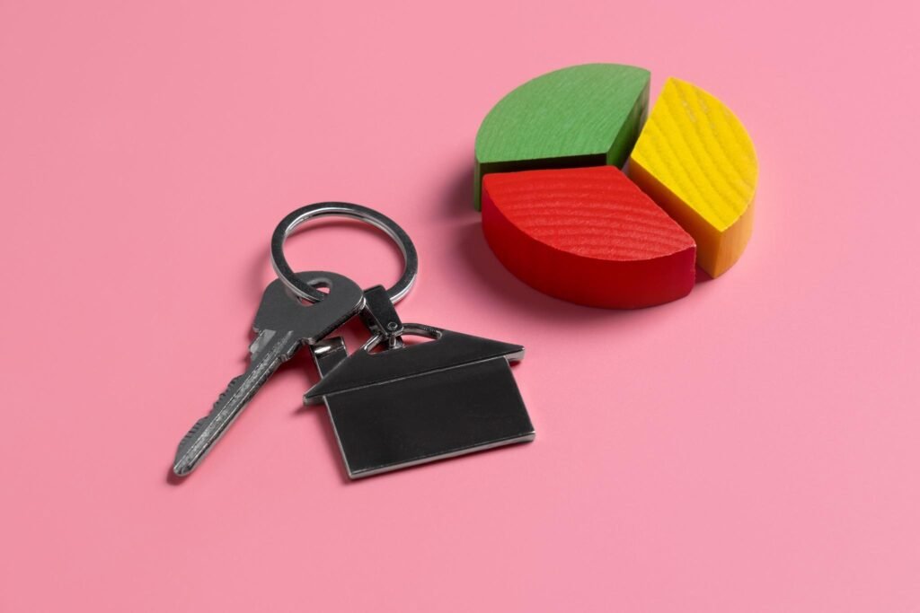 "A close-up of house keys resting on a stack of mortgage documents, symbolizing home ownership protection through UK lifestyle life insurance."