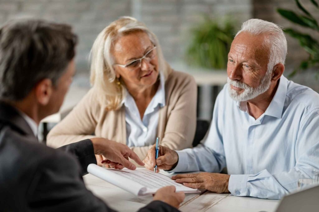 Canadian retirees discussing life insurance options for 2025 with an advisor.