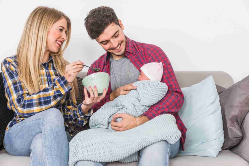 A happy young millennial couple with their baby, symbolizing the need for term life insurance millennials to protect growing families.