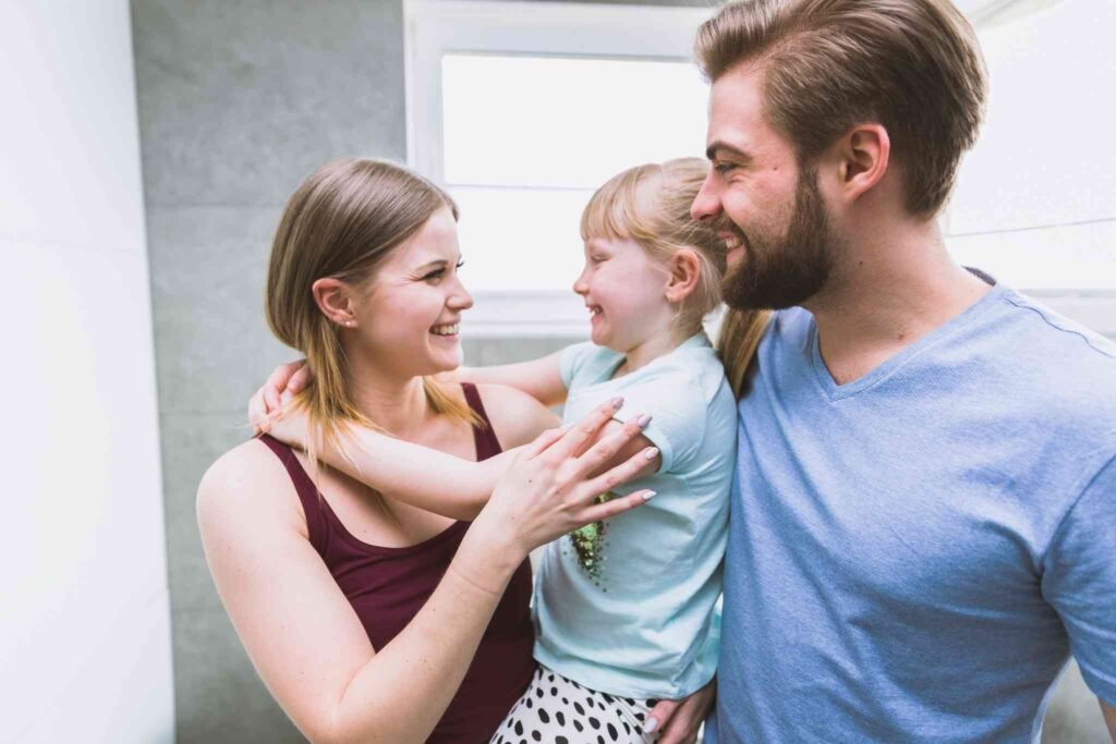 Parents feeling secure and confident with their family life insurance Australia policy in place.