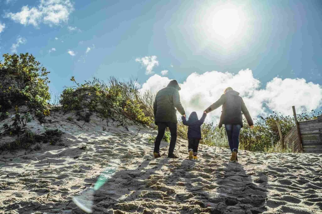 "Happy family enjoying life after a health journey, symbolizing security with cancer survivor life insurance."